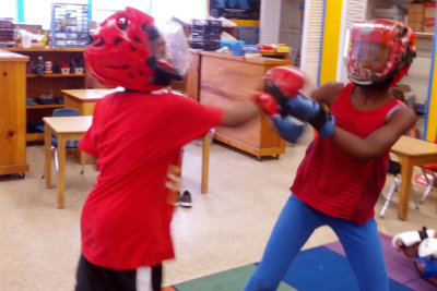 two little children doing kickboxing